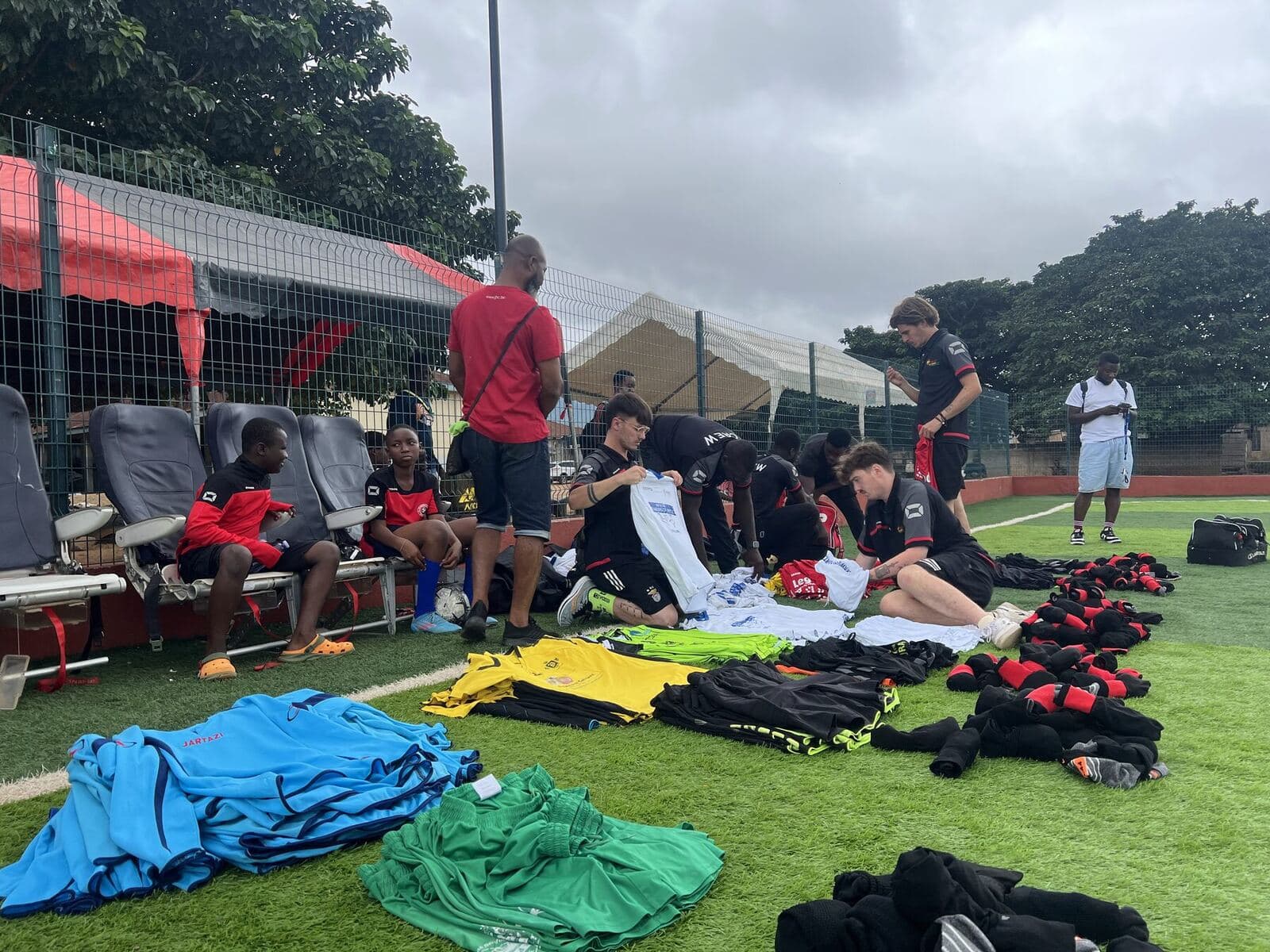Kits and boots laid out on the pitch before the tournament