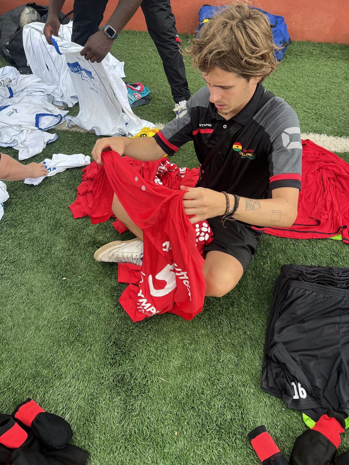 Volunteer sorting donated jerseys