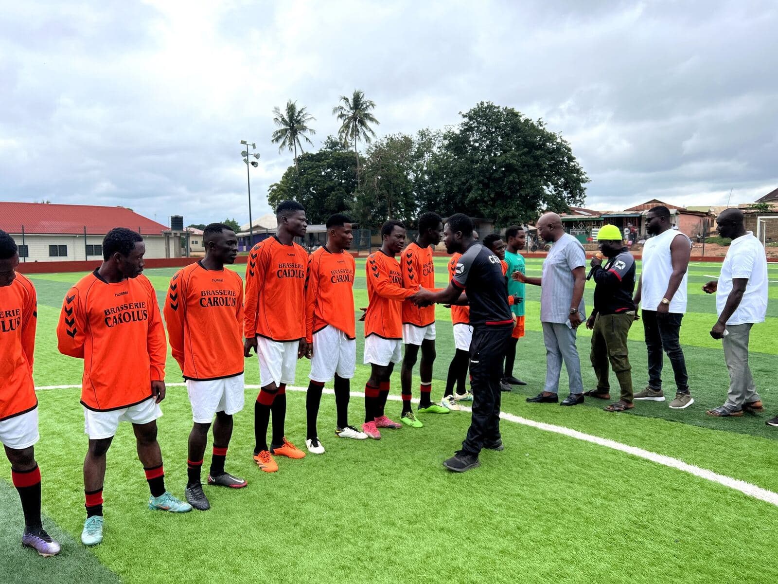 Teams lining up and shaking hands before kick-off