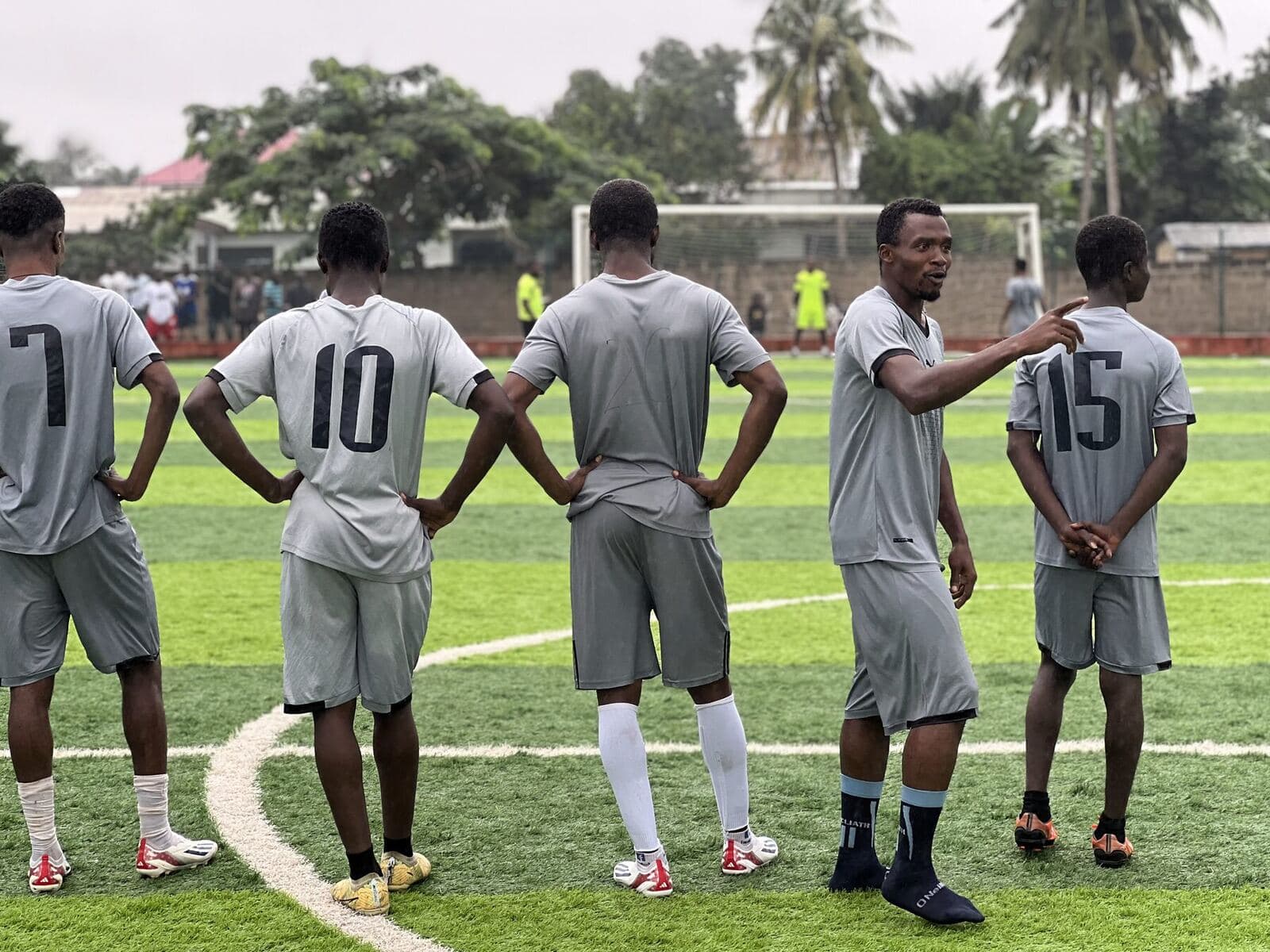 Team in grey before kick-off, numbers on their backs