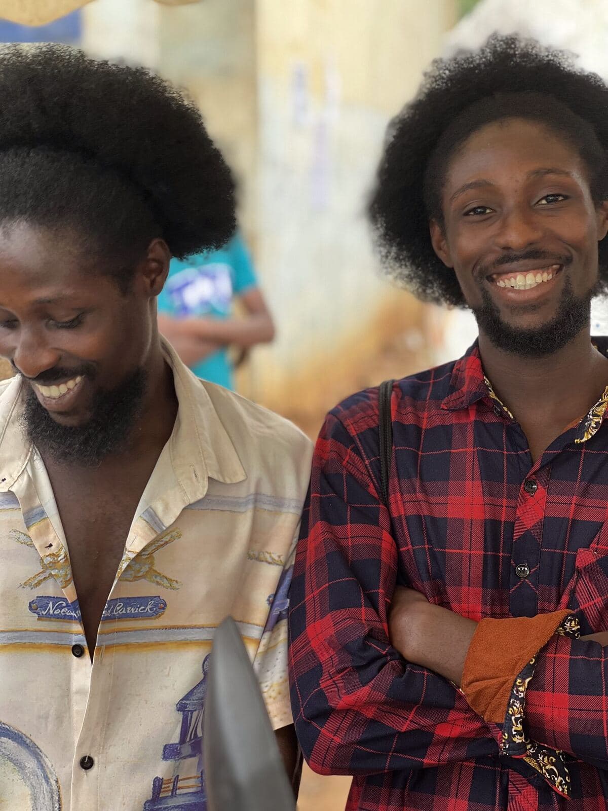 Two supporters smiling at the camera
