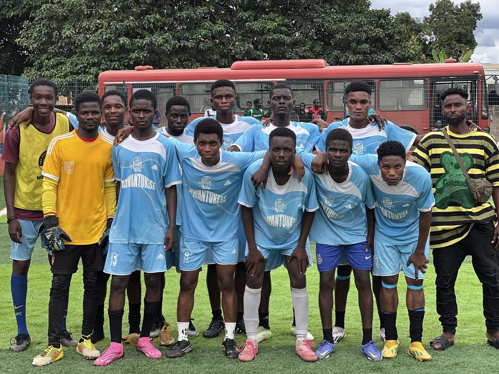 Team in light blue with their staff